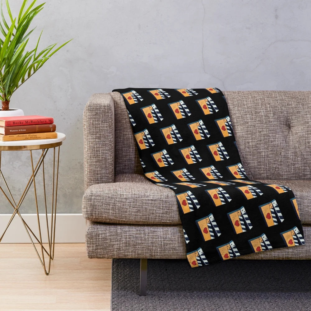 Soft and plush cinema-themed blanket for movie lovers
