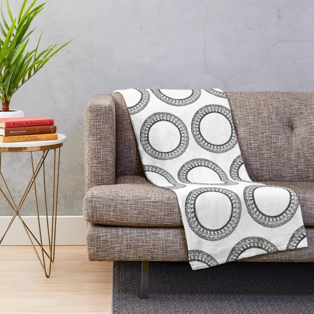 Plush circular blanket with artesian patterns