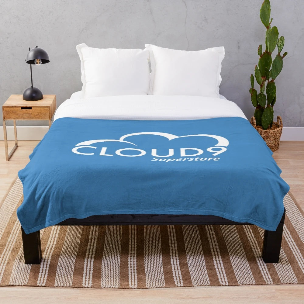 White plush blanket with Cloud 9 Superstore inspired design