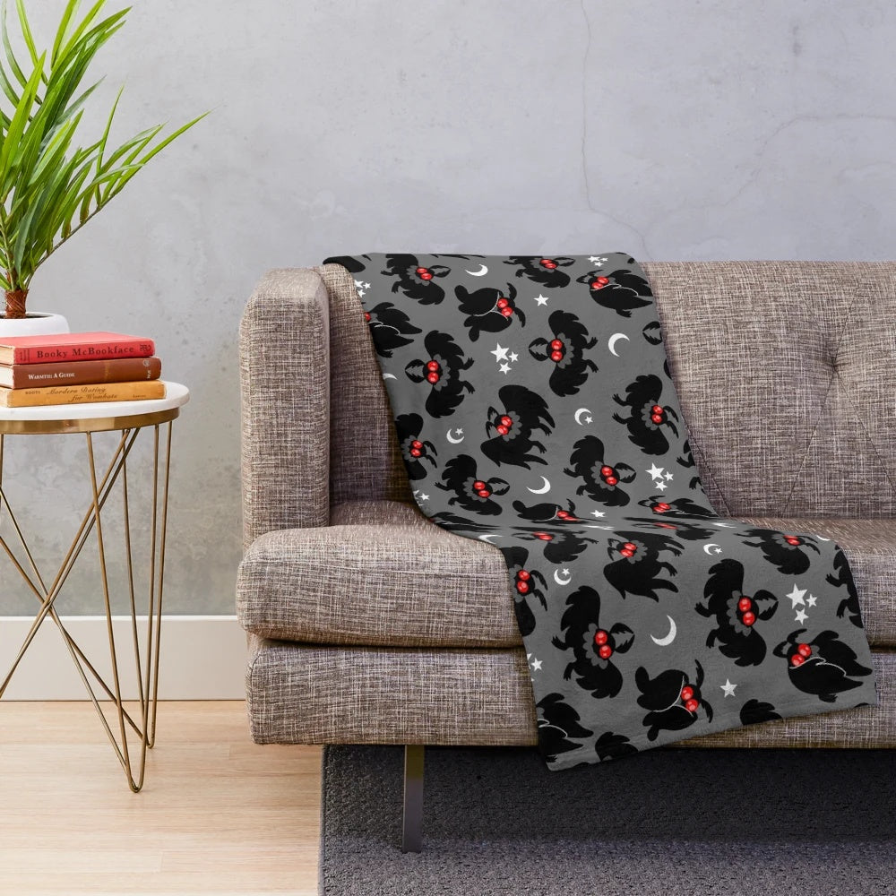 Mothman pattern plush blanket, featuring a cozy cryptid design