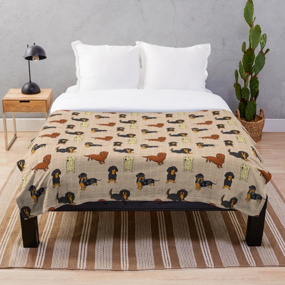 Cream colored plush blanket with a dachshund dog design