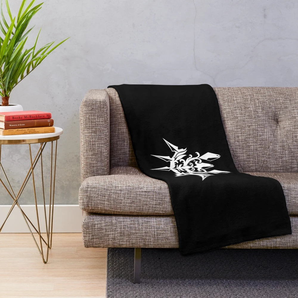 Dark plush blanket with machine-inspired, futuristic design