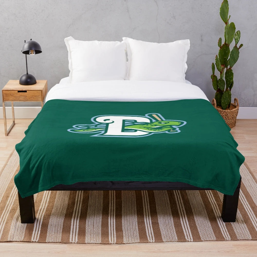 A soft and plush blanket featuring the Daytona Tortugas logo and team colors