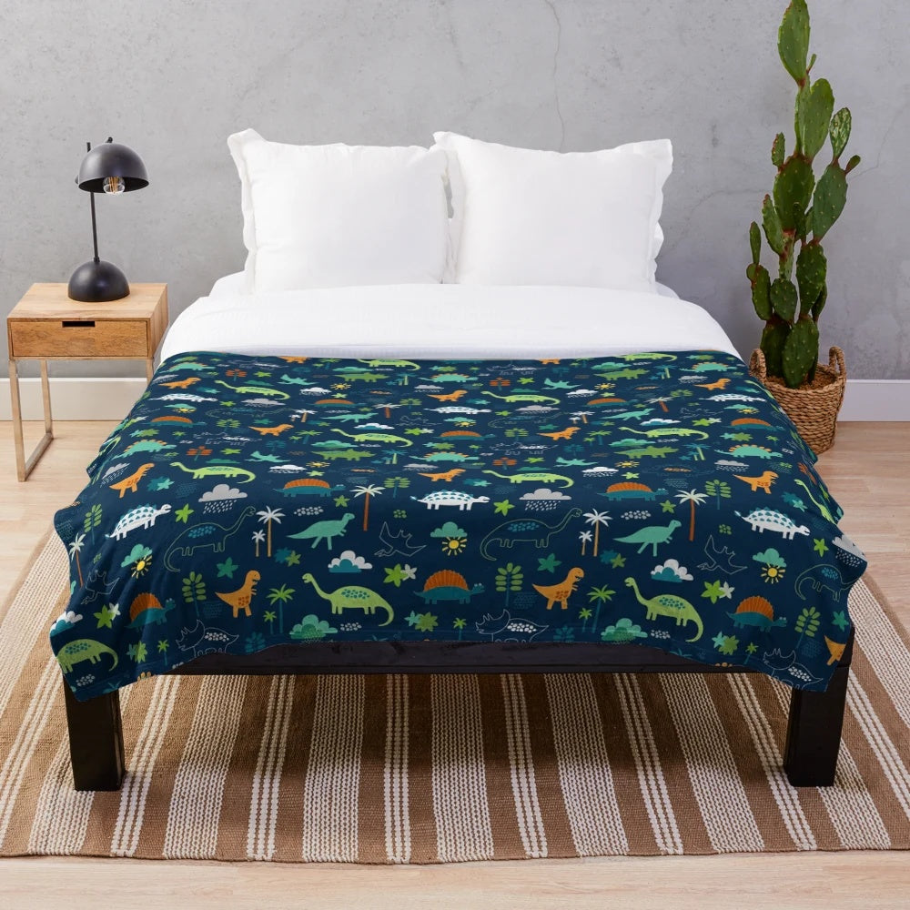 Dinosaur Land plush blanket featuring a cute dino pattern design