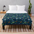 Dinosaur Land plush blanket featuring a cute dino pattern design