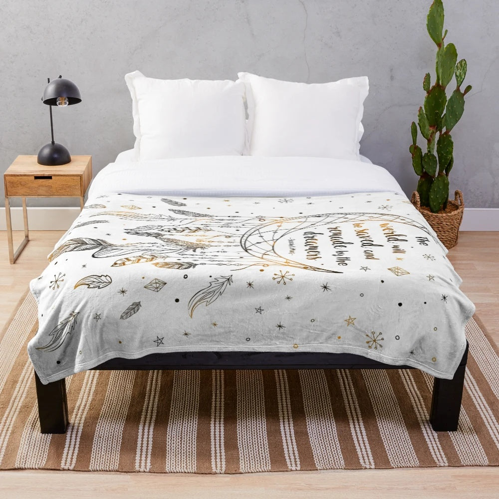 Cozy plush blanket featuring a dreamcatcher design with stars and feathers