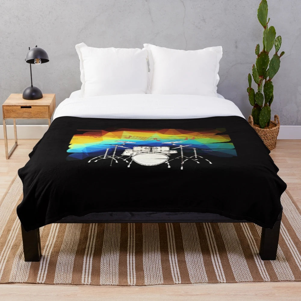 Plush blanket with drumming and musical design