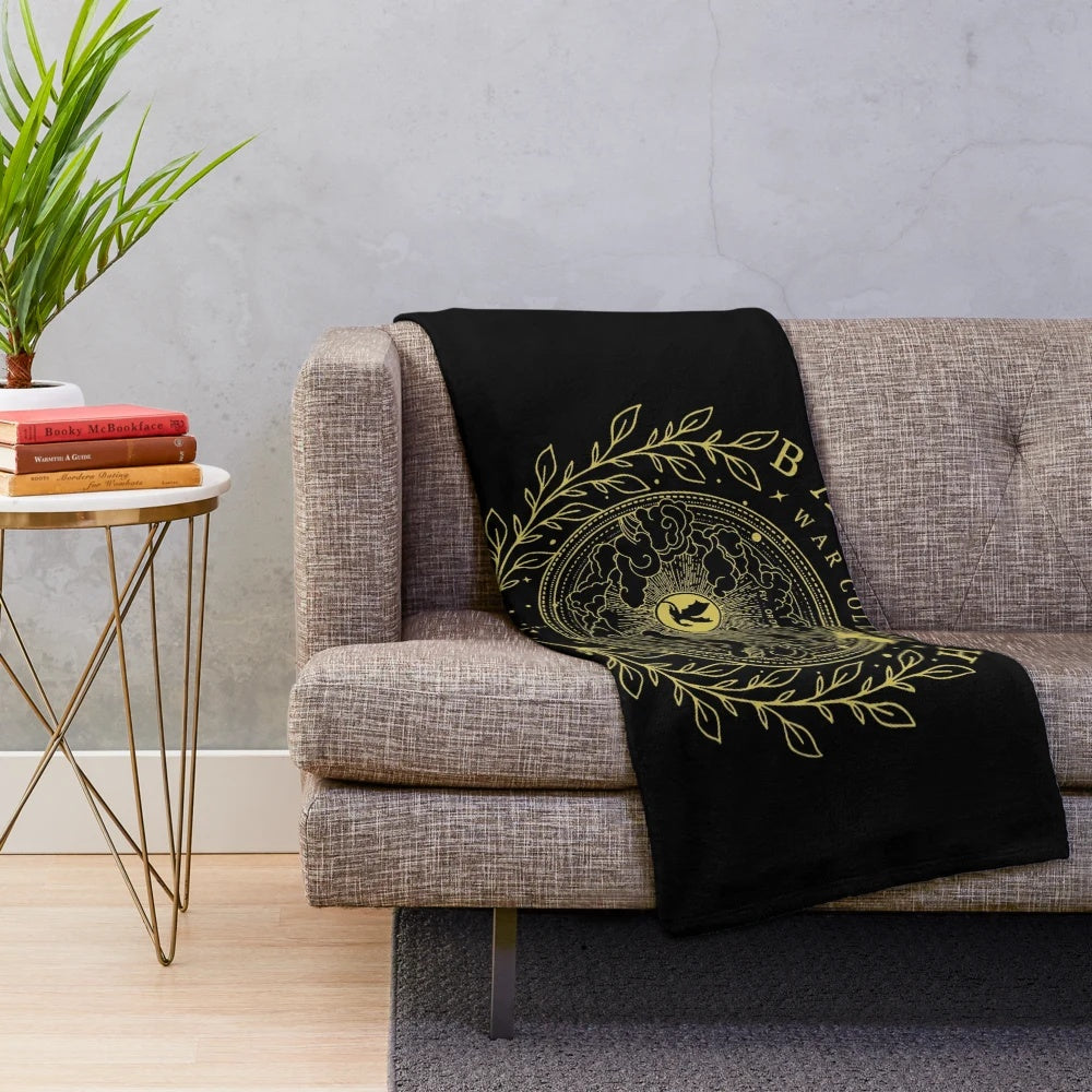 A plush, cozy blanket featuring a fantasy book lover design, perfect for fans of the Empyrean series.