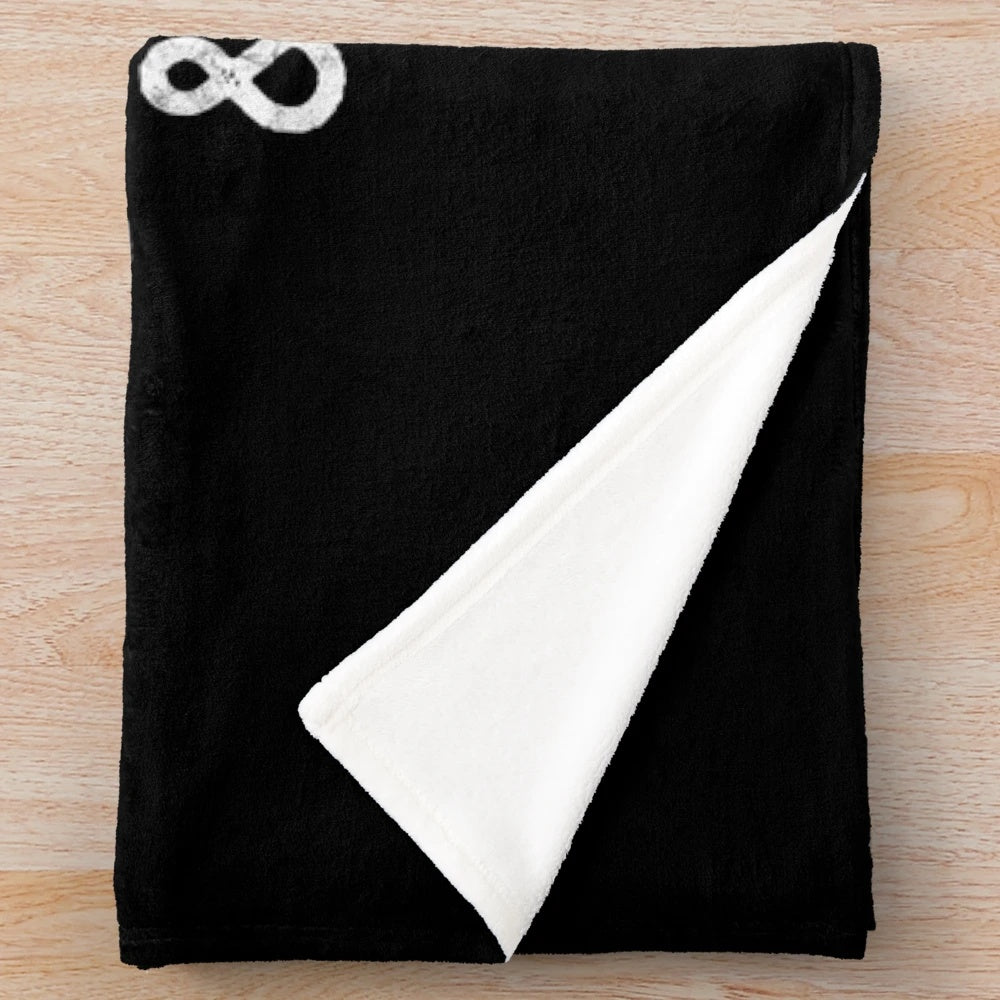 Girl reading fantasy book on cozy plush blanket with dragons