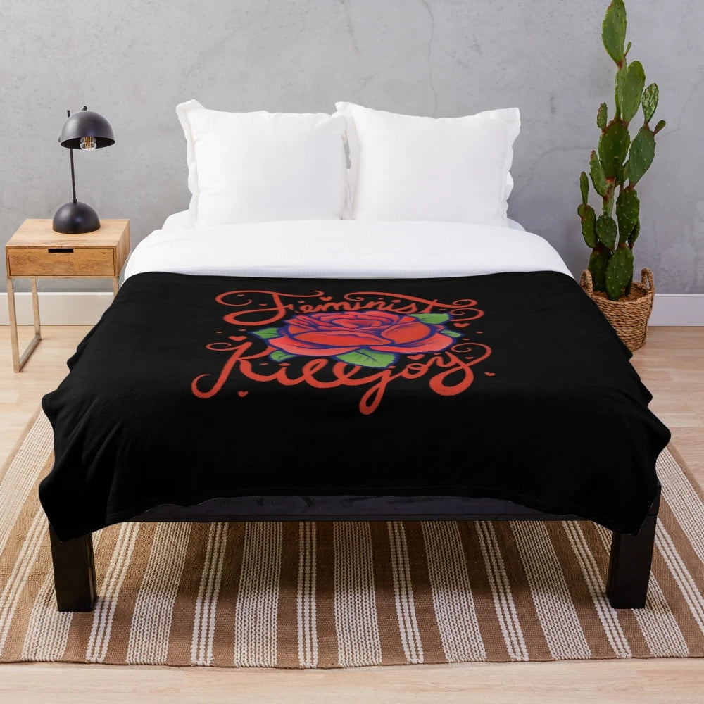Soft and cozy red rose plush blanket featuring a feminist killjoy design