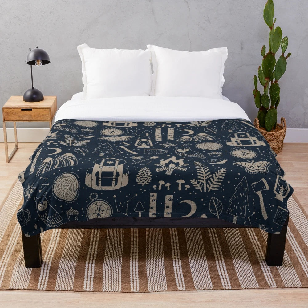 Forest-themed plush blanket with nature motifs