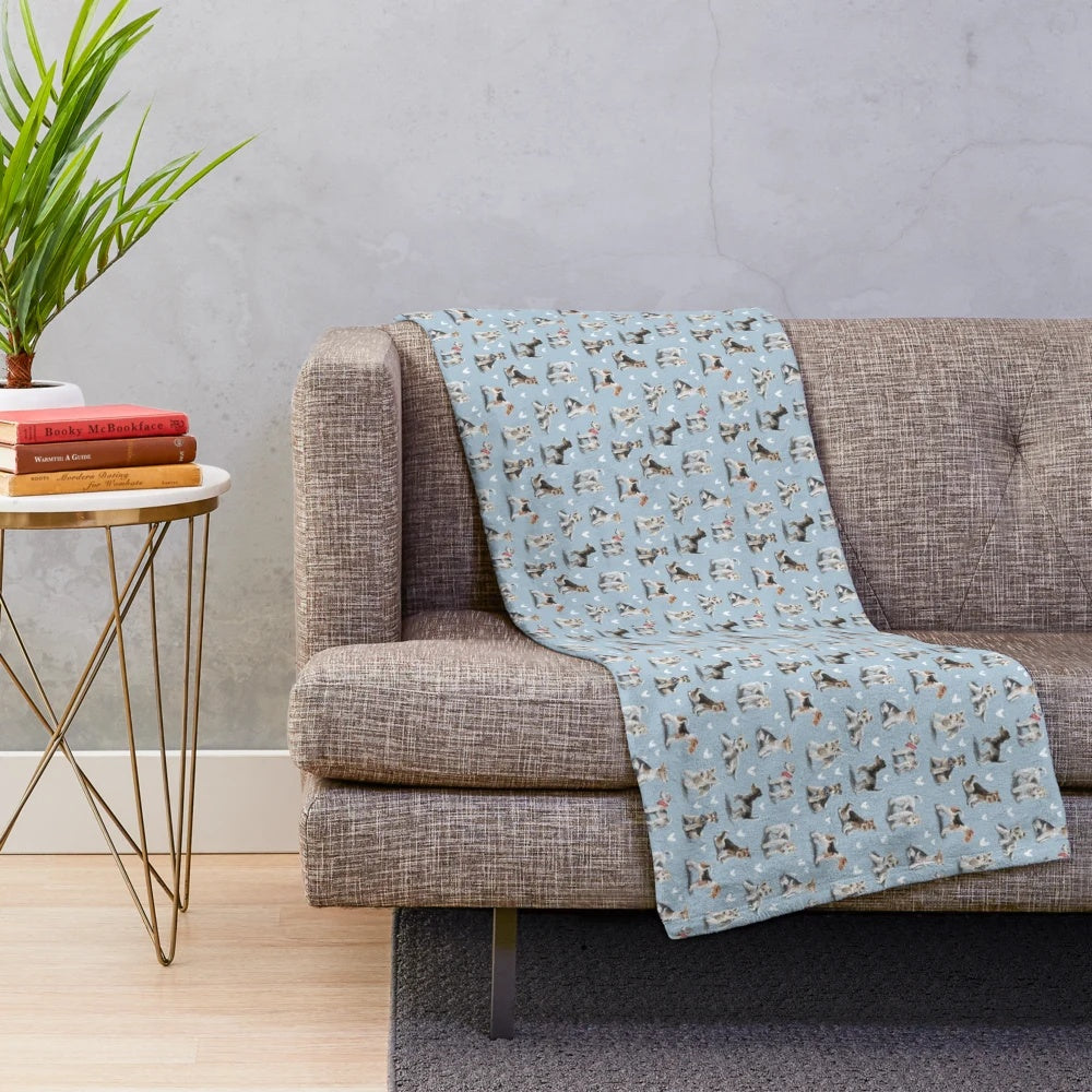 A soft, plush blanket featuring the image of a fox terrier dog