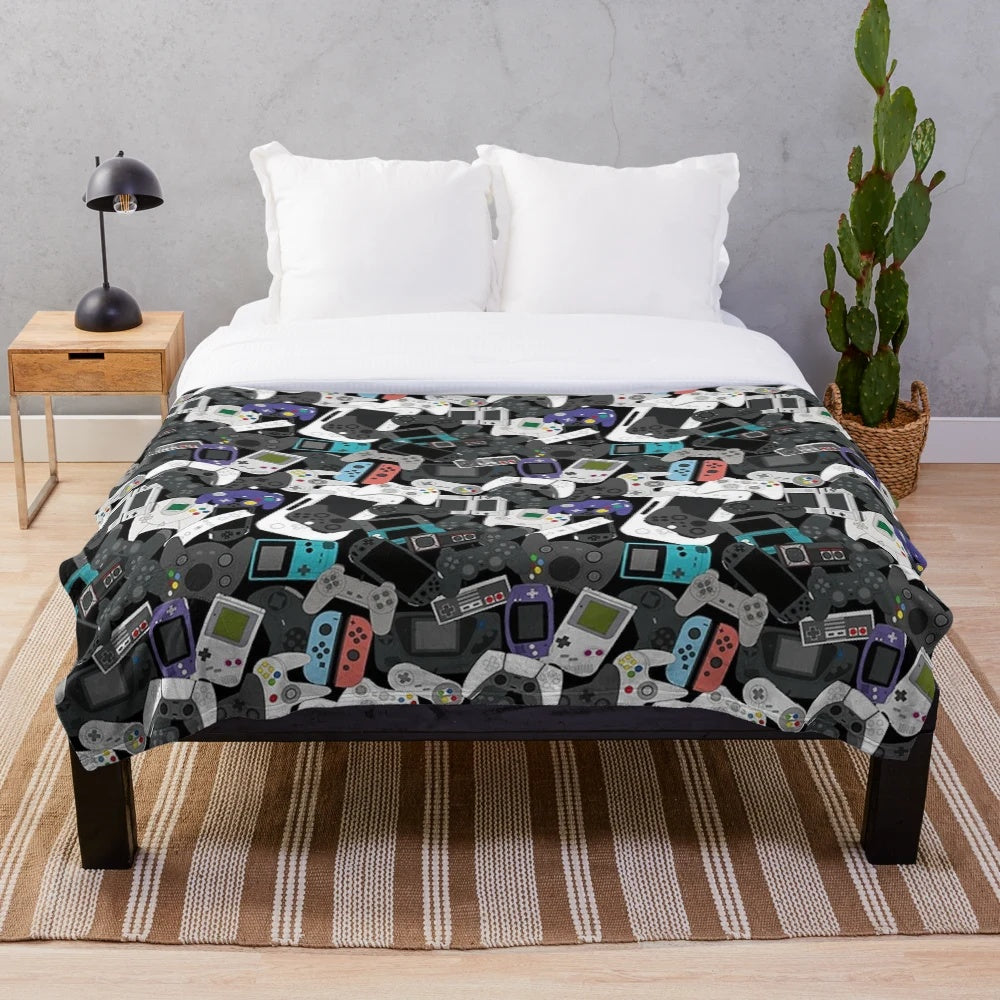 Plush gaming blanket featuring a retro game controller design