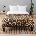 Giraffe print plush blanket with soft, luxurious texture