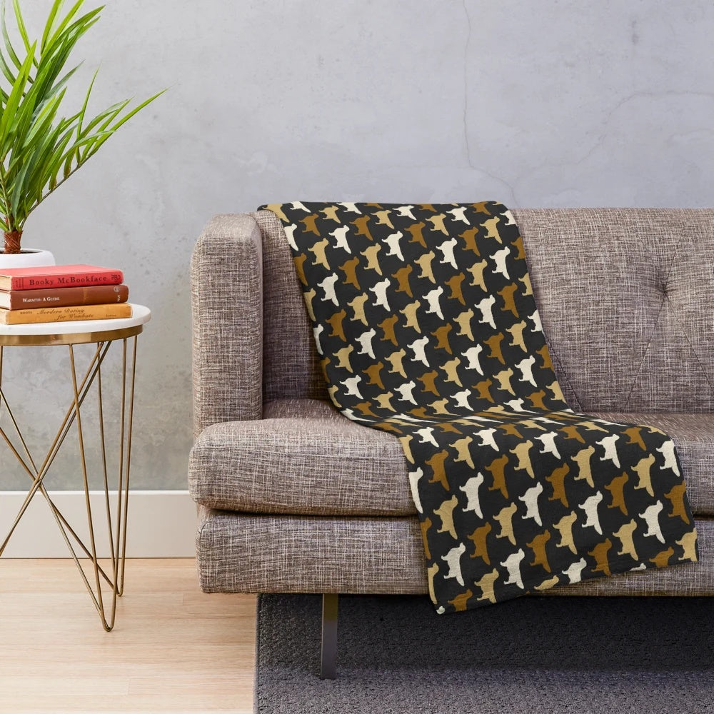 Golden Retriever dog breed silhouette on a plush blanket