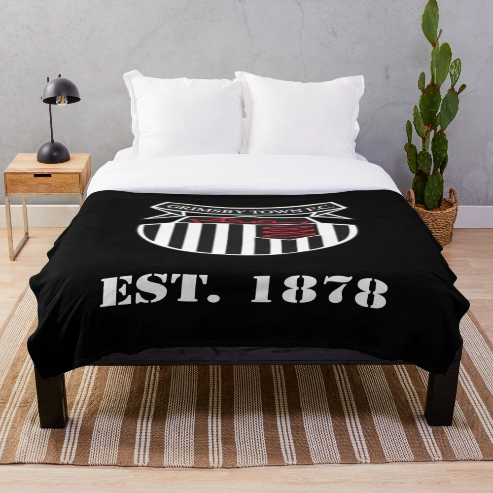 Cozy plush blanket featuring the Grimsby Town FC logo