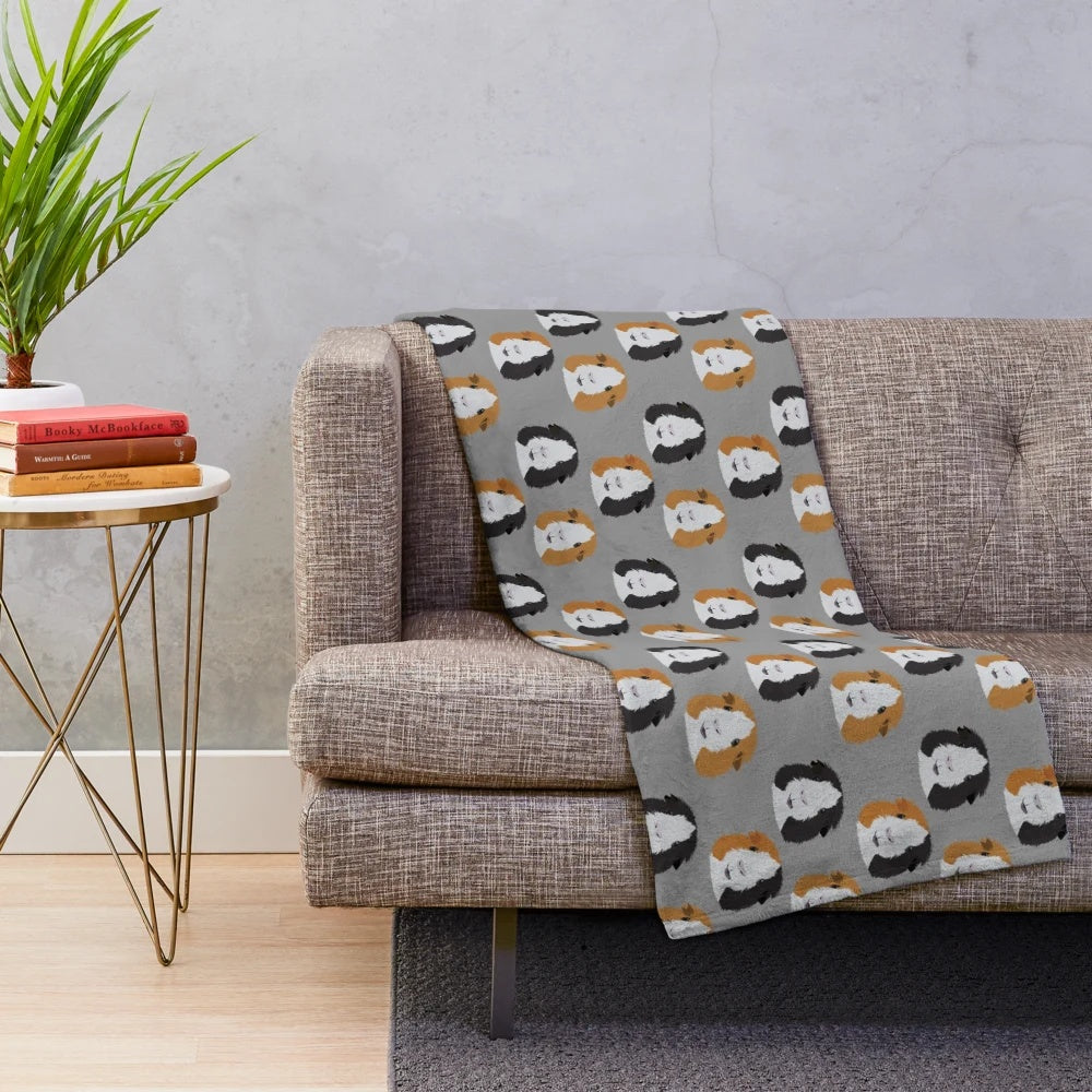 Soft and cuddly plush blanket featuring three adorable guinea pigs