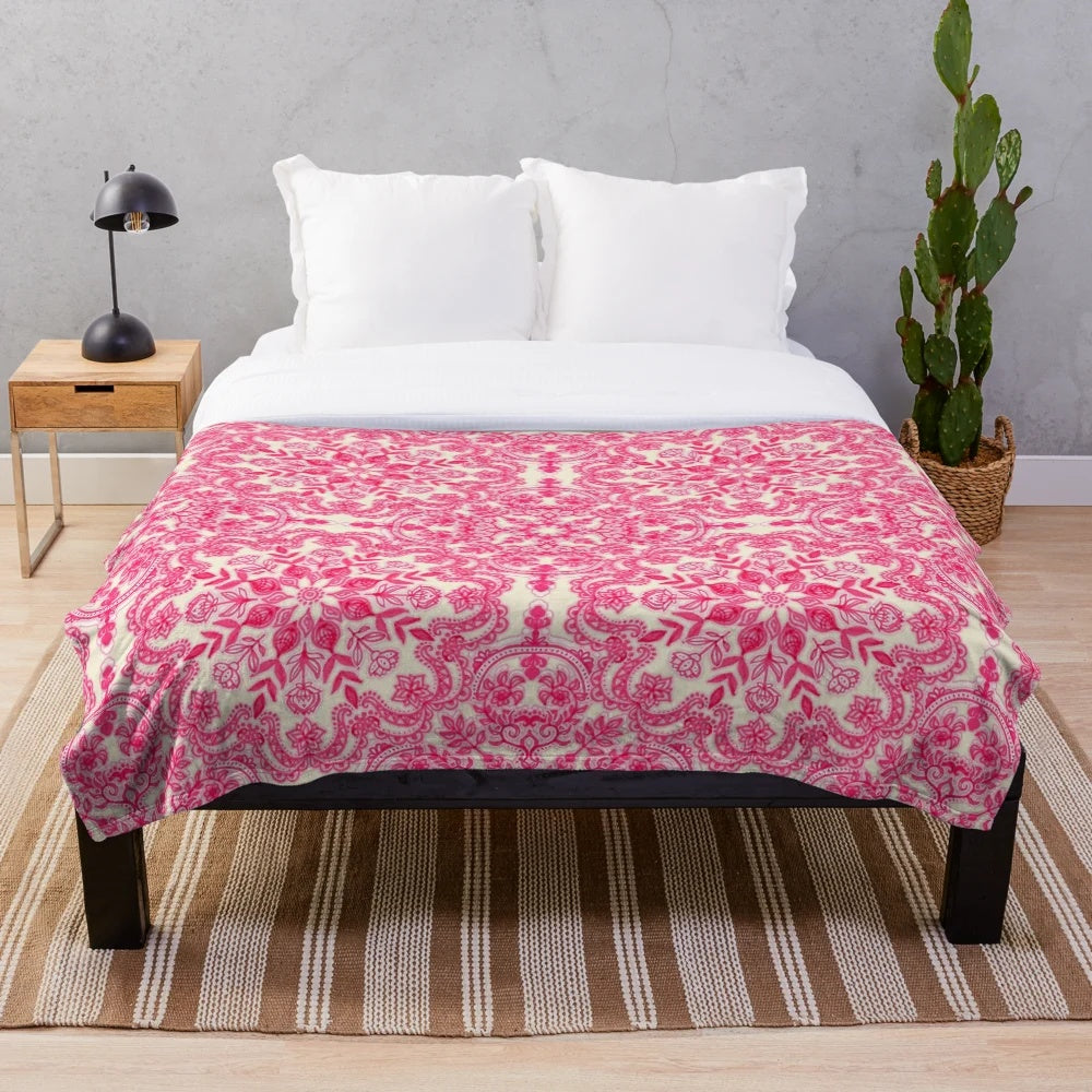 Hot pink and soft cream plush blanket with folk art pattern