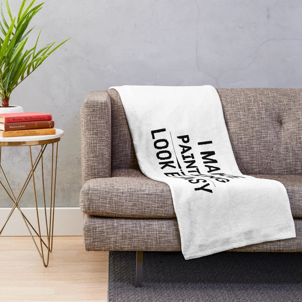 Plush blanket with "I Make Painting Look Easy" design