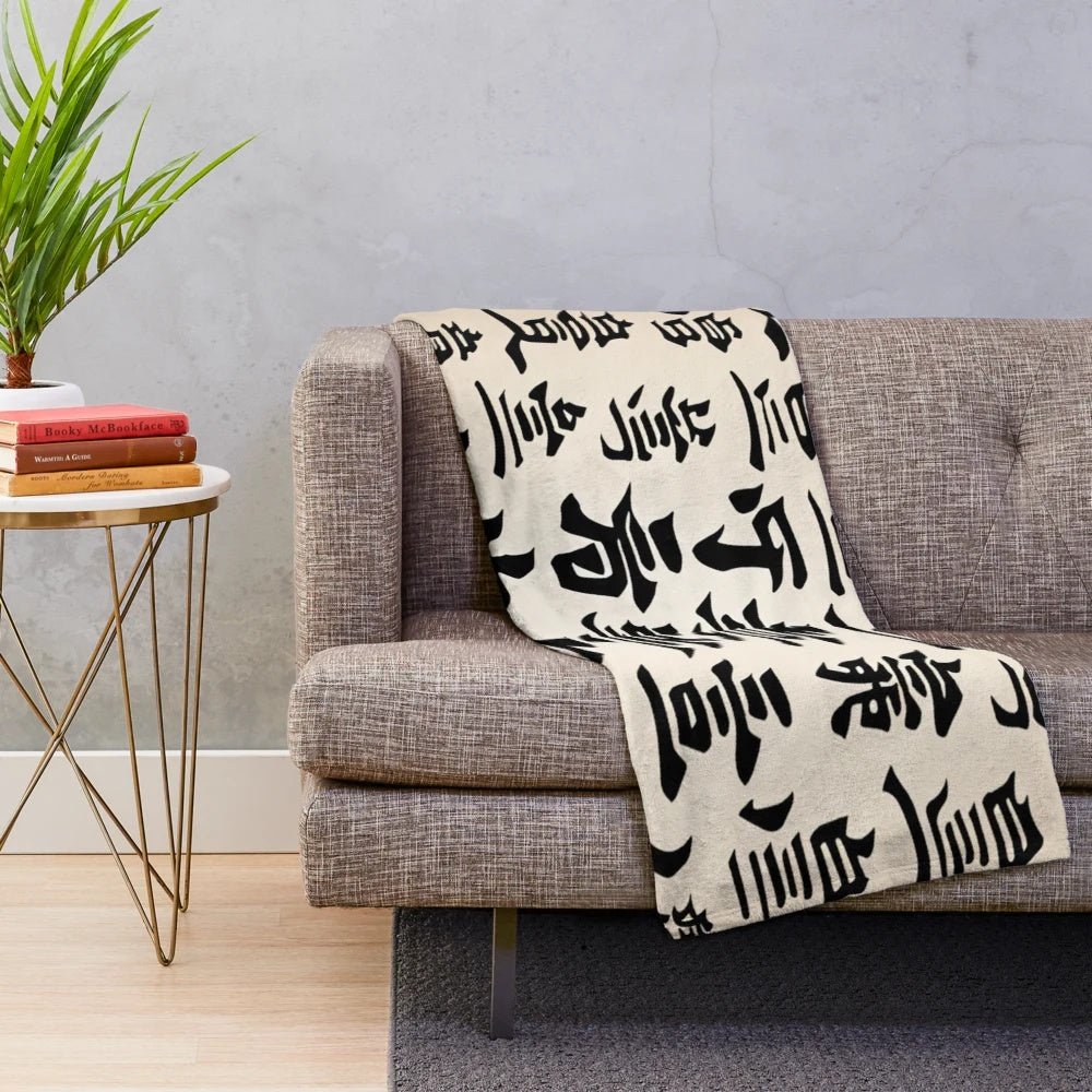 Japanese kanji characters printed on a soft, plush blanket