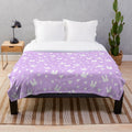 Purple plush bunny blanket with a soft, fluffy design