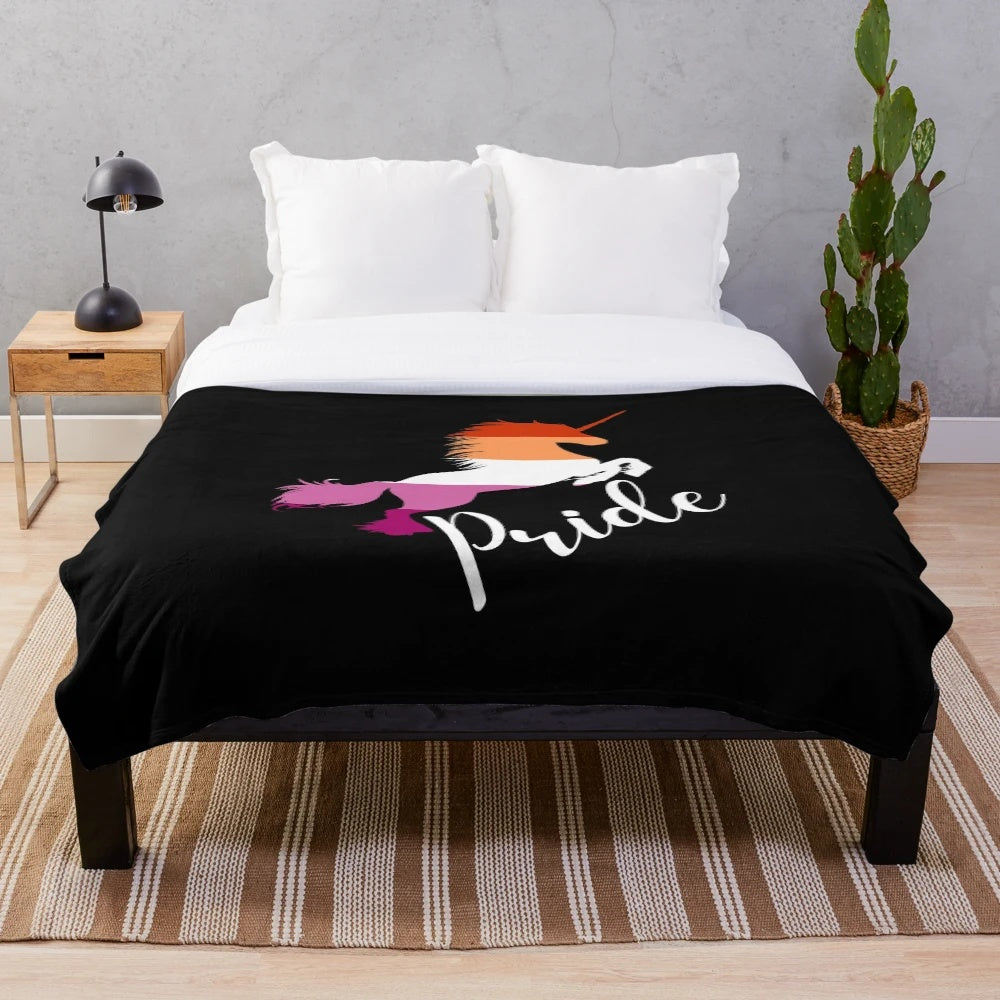 Plush unicorn blanket in lesbian pride colors