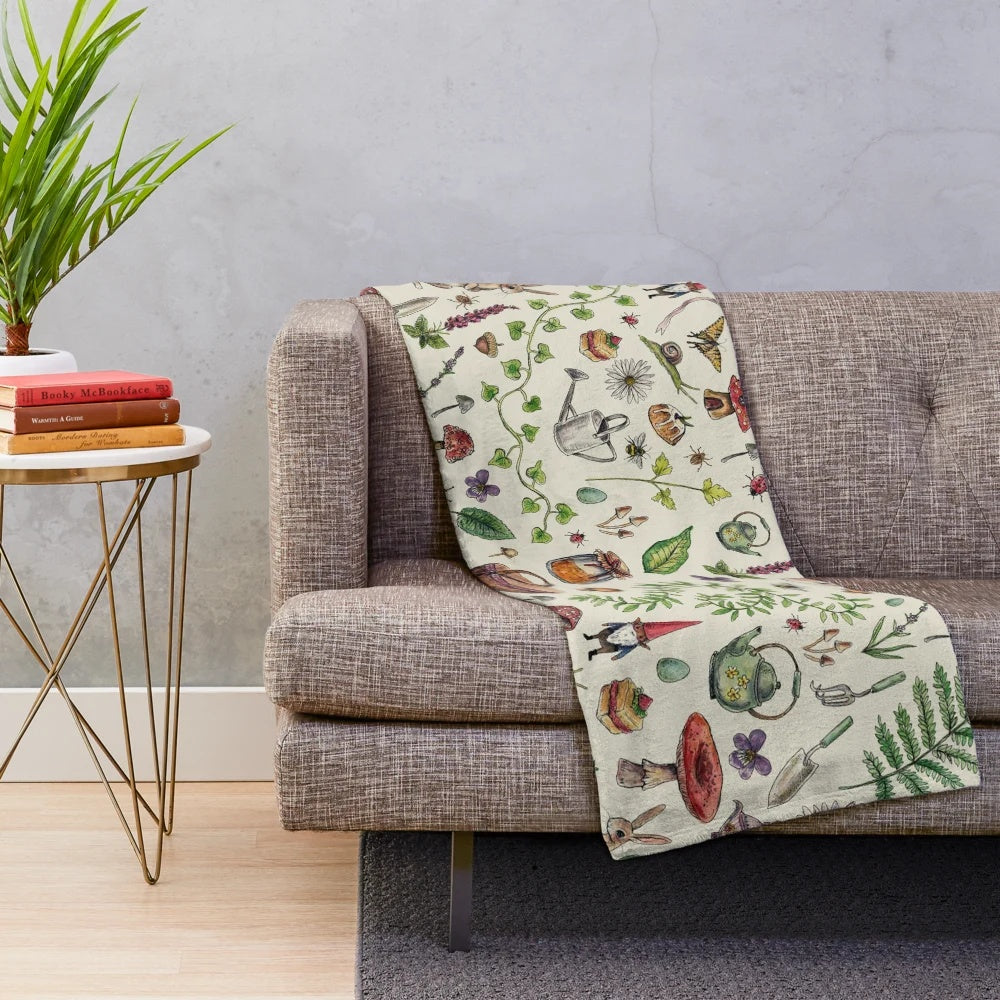 Light green plush cottagecore-style blanket with nature and magic-inspired details