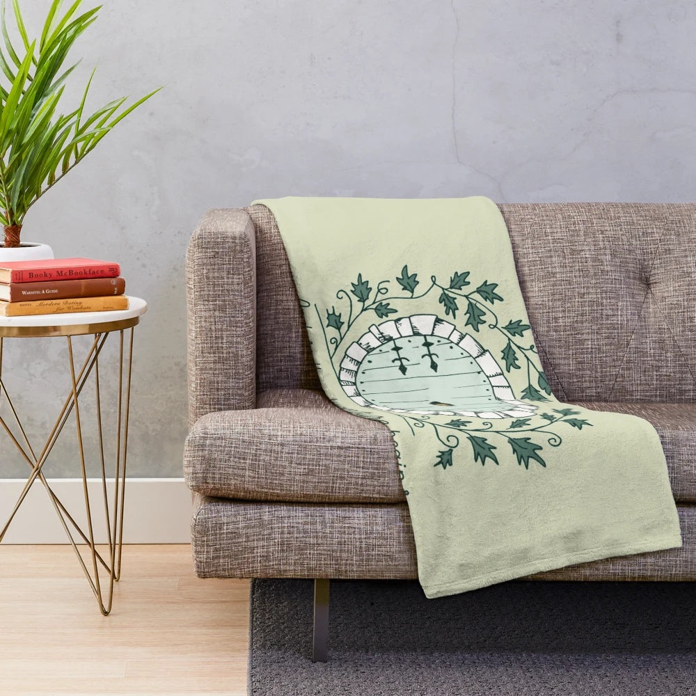 Plush blanket featuring a Bilbo Baggins-inspired design with The Shire and Middle Earth elements