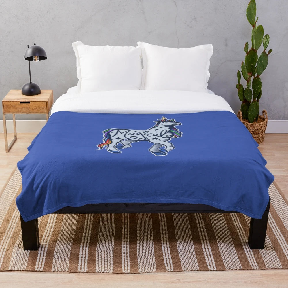 Magical unicorn plush blanket with vibrant rainbow design