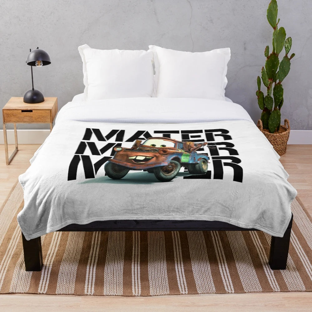 Mater the tow truck character from the Cars cartoon on a plush blanket