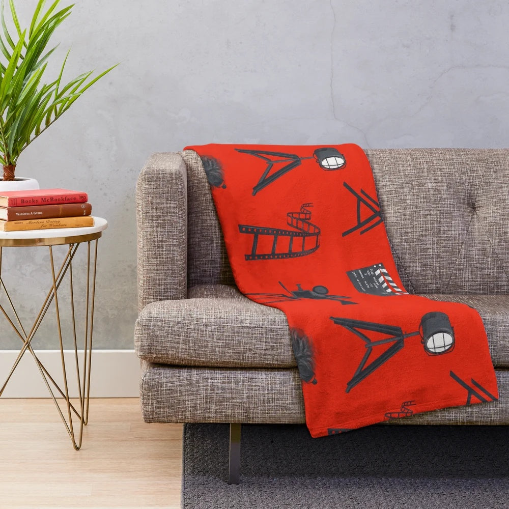 Plush movie lover blanket with cinema and film-themed pattern