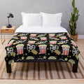 Plush blanket with popcorn design, perfect for movie nights