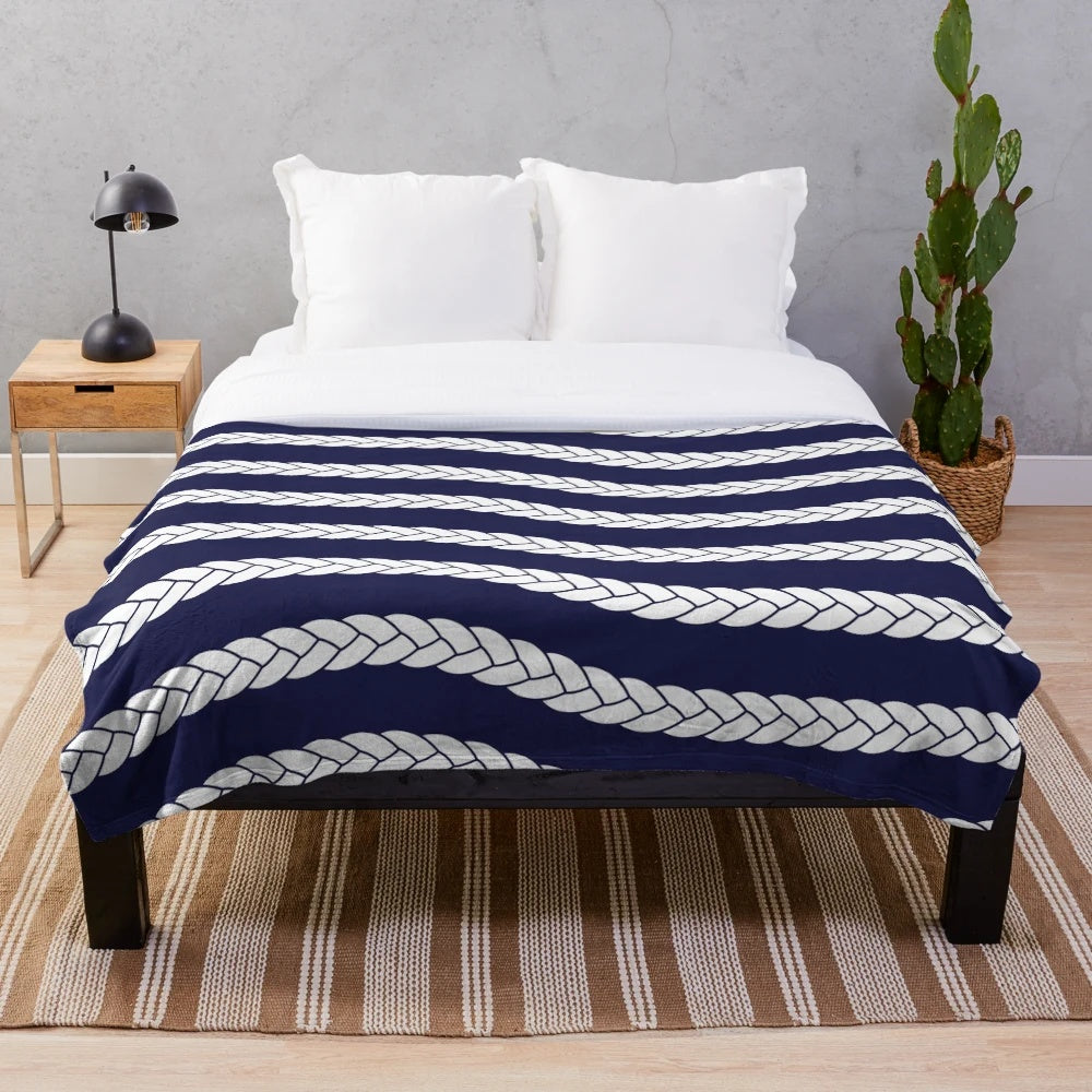 Nautical plush blanket with navy and white braid pattern