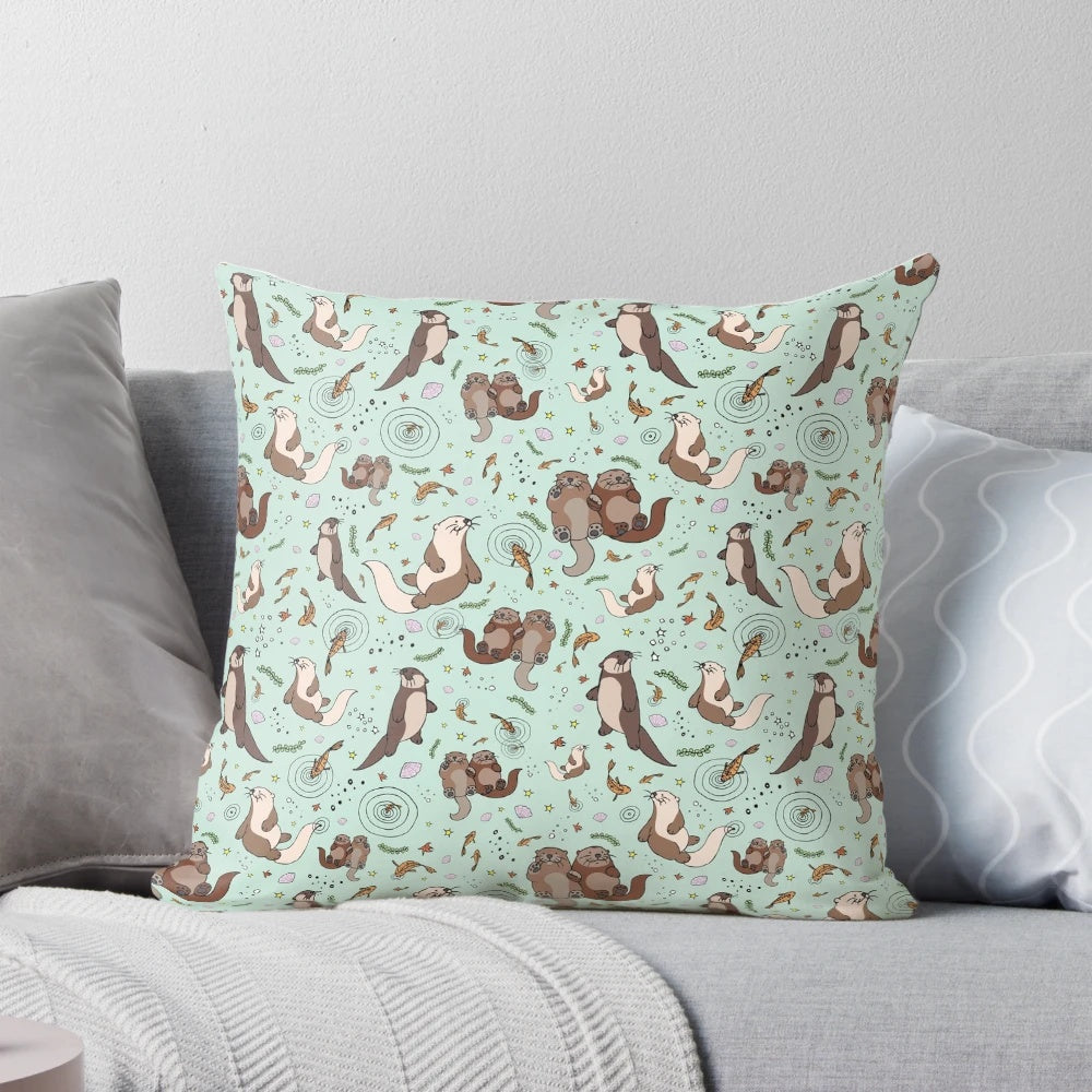 A soft, plush pillow featuring a cute and cozy sea otter design, perfect for otter enthusiasts.