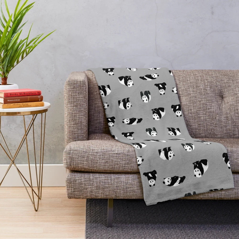 Soft and cuddly grey plush blanket featuring adorable pandas