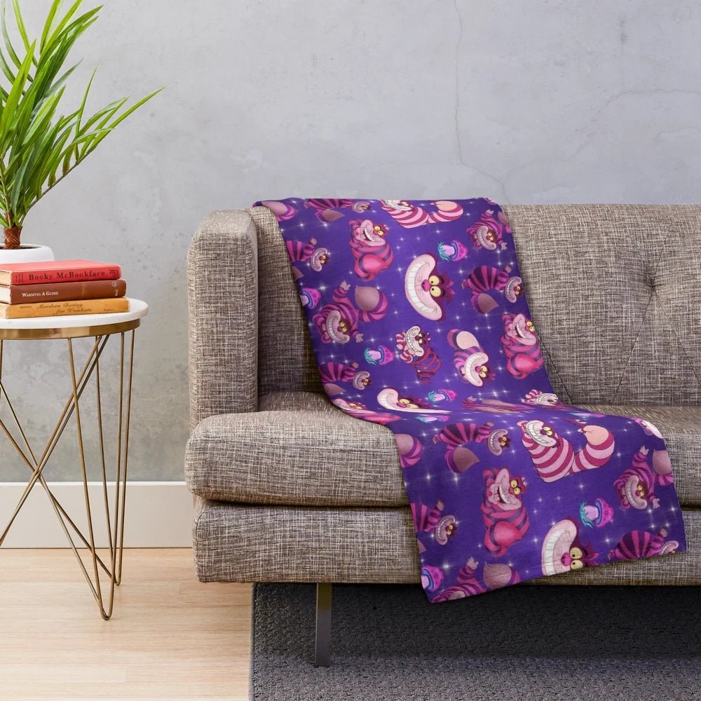 Plush blanket with a wonderland design featuring a cat and mushrooms