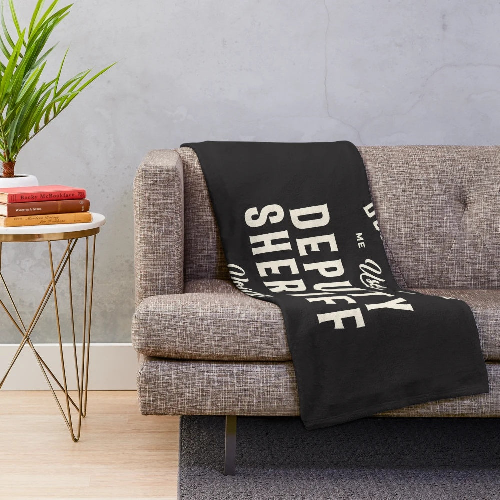 Plush blanket with deputy sheriff design