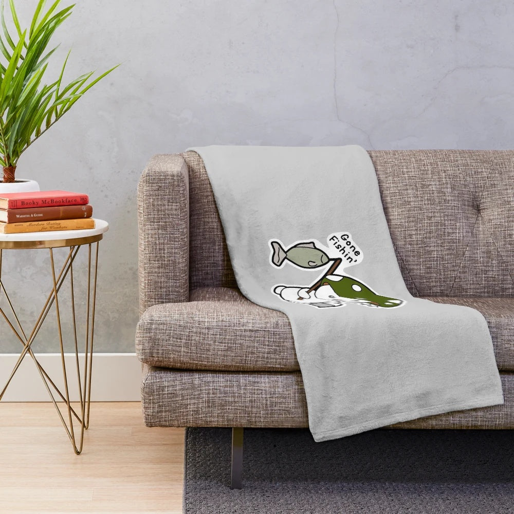 Cozy plush blanket with a whimsical fishing design