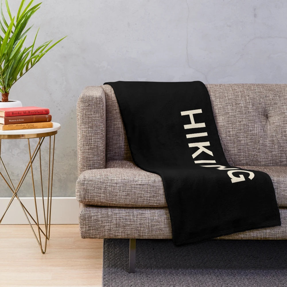 Plush blanket featuring hiking and outdoor designs