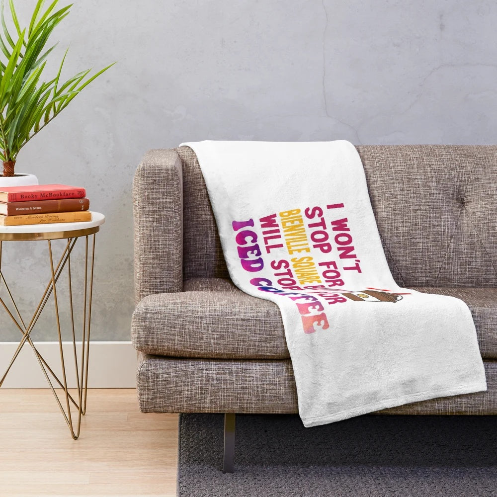 Plush blanket with the text "I Won't Stop For Bienville Square But I'll Stop For Iced Coffee