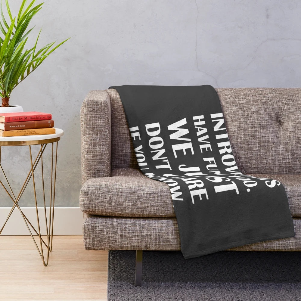 Cozy introvert plush blanket with the text "Introverts Have Fun Too. We Just Don't Care If You Know.