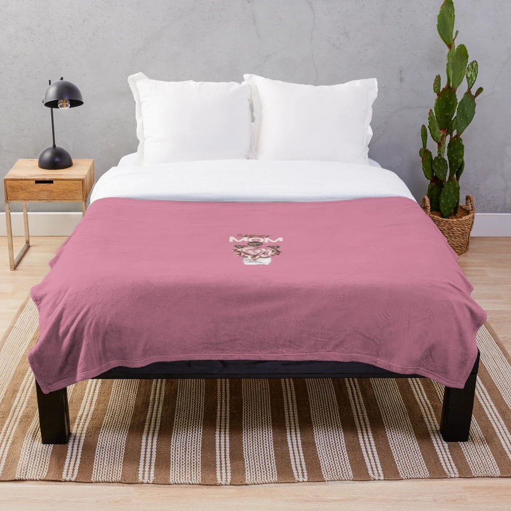 Soft, plush blanket with 'Super MOM' text in black and white design