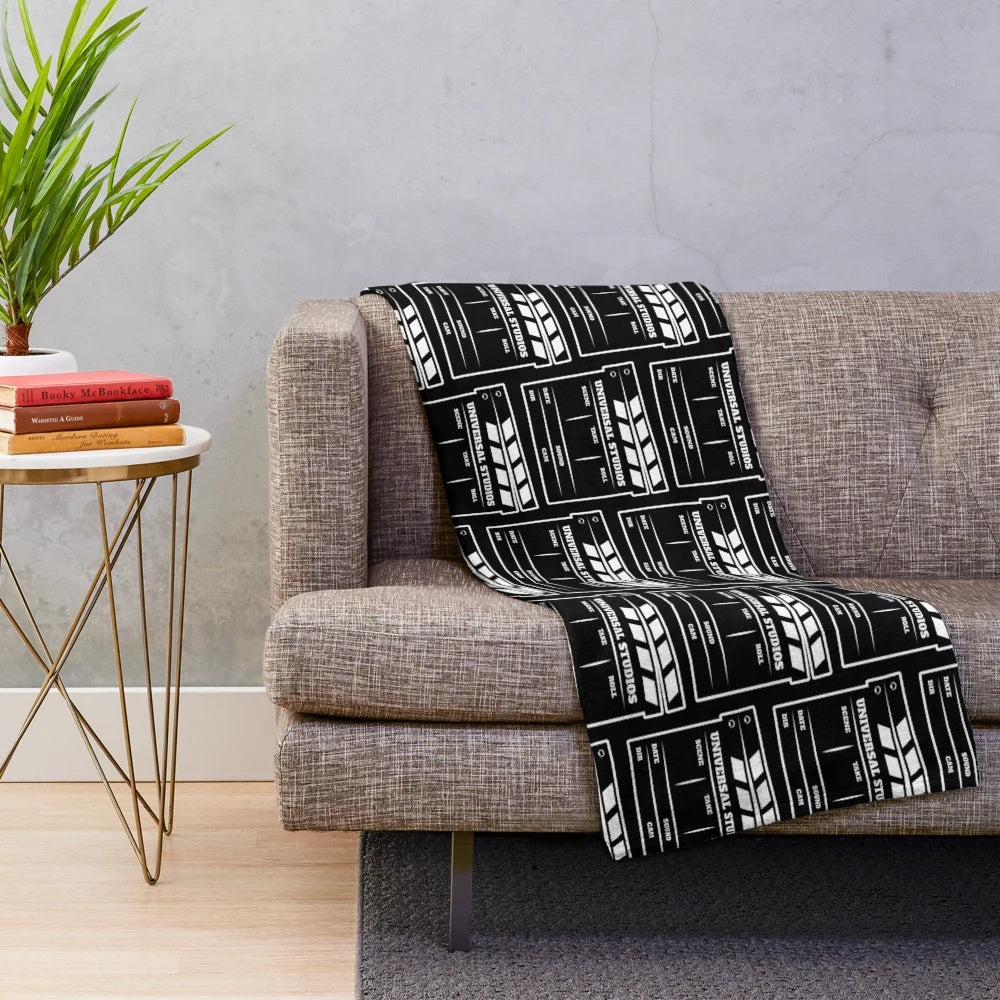 Plush blanket featuring a clapperboard design for movie fans