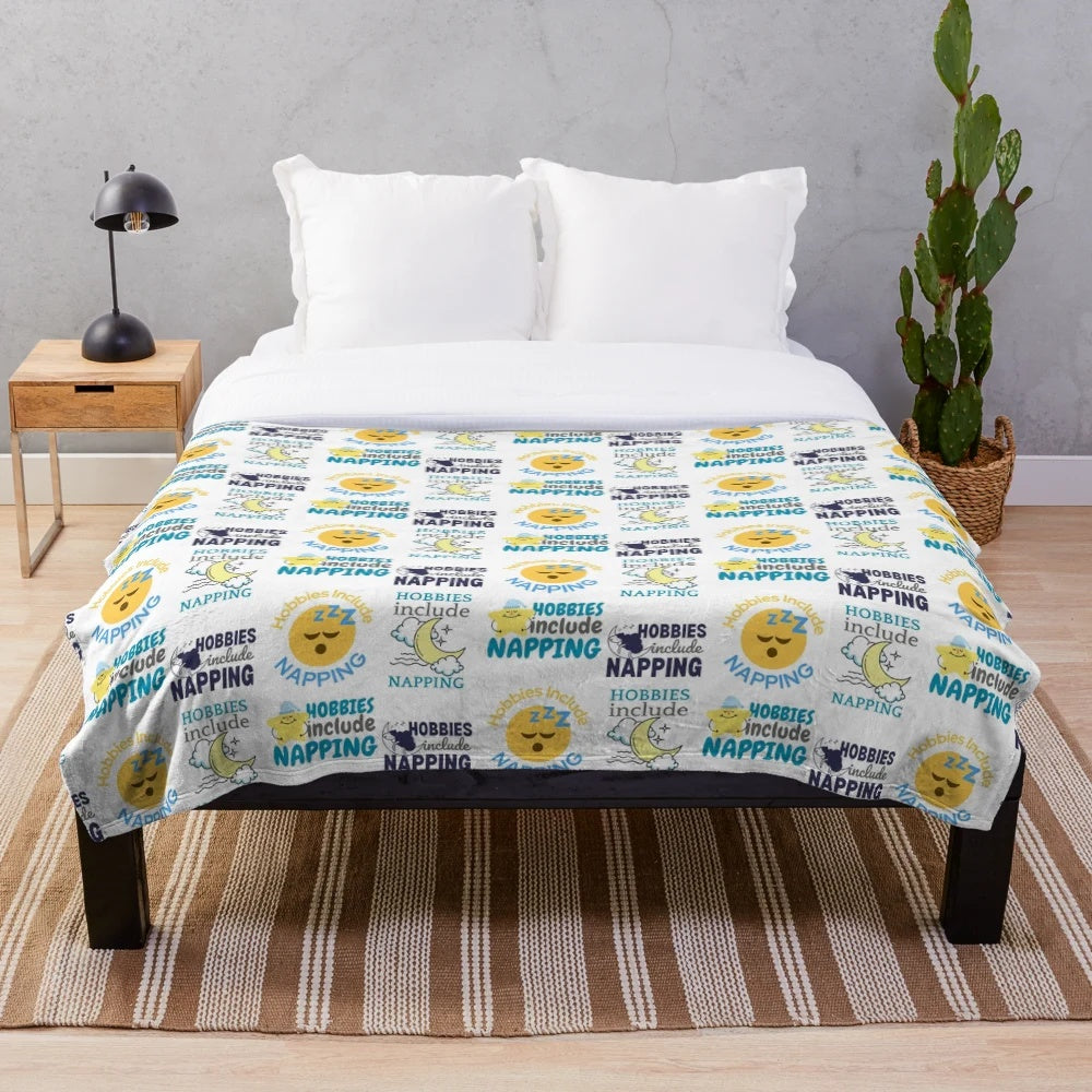 Plush blanket with napping and sleep-themed graphic
