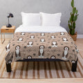 Soft and cuddly plush blanket featuring a cute Portuguese Water Dog on a brown background