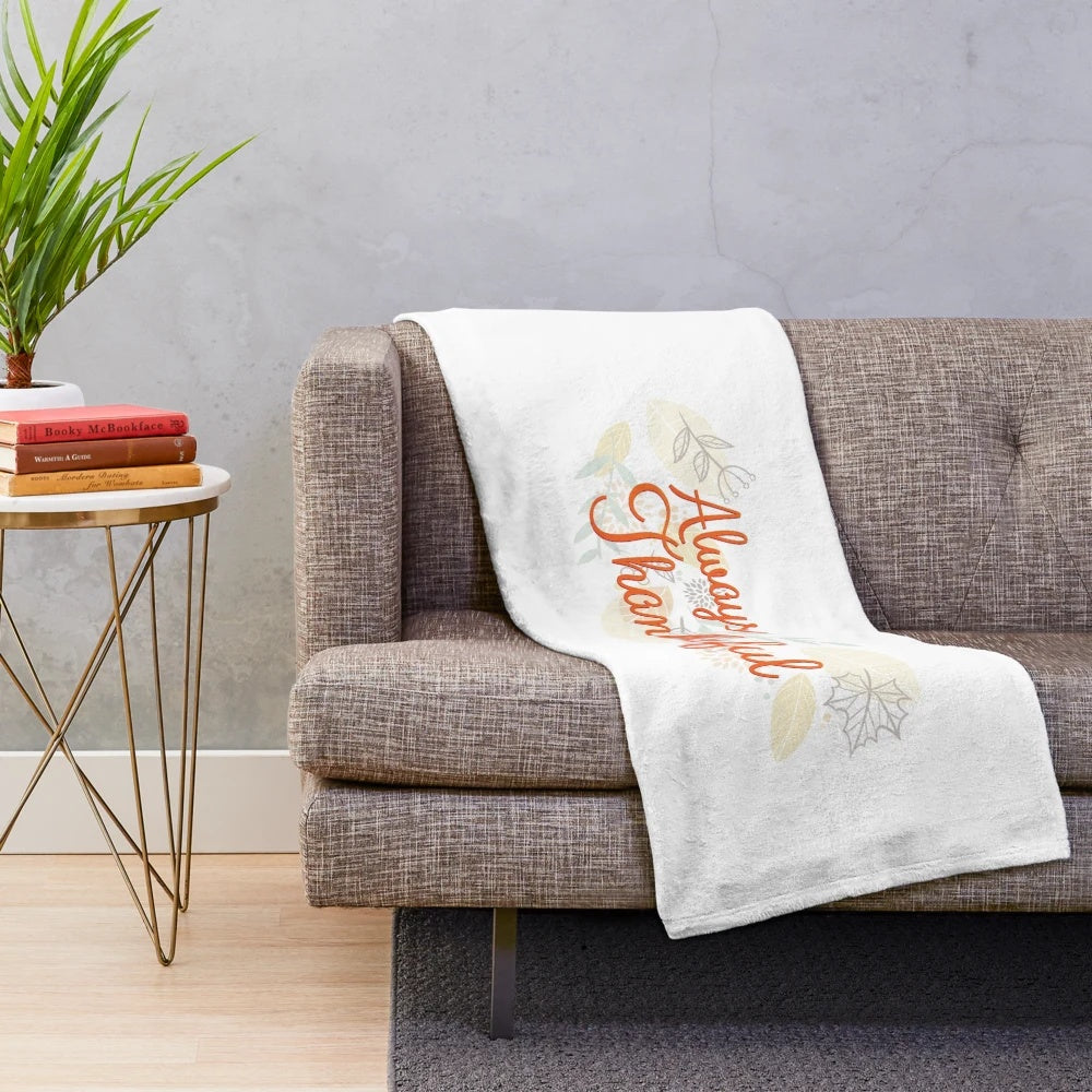 Plush blanket with autumn leaves and thanksgiving motif