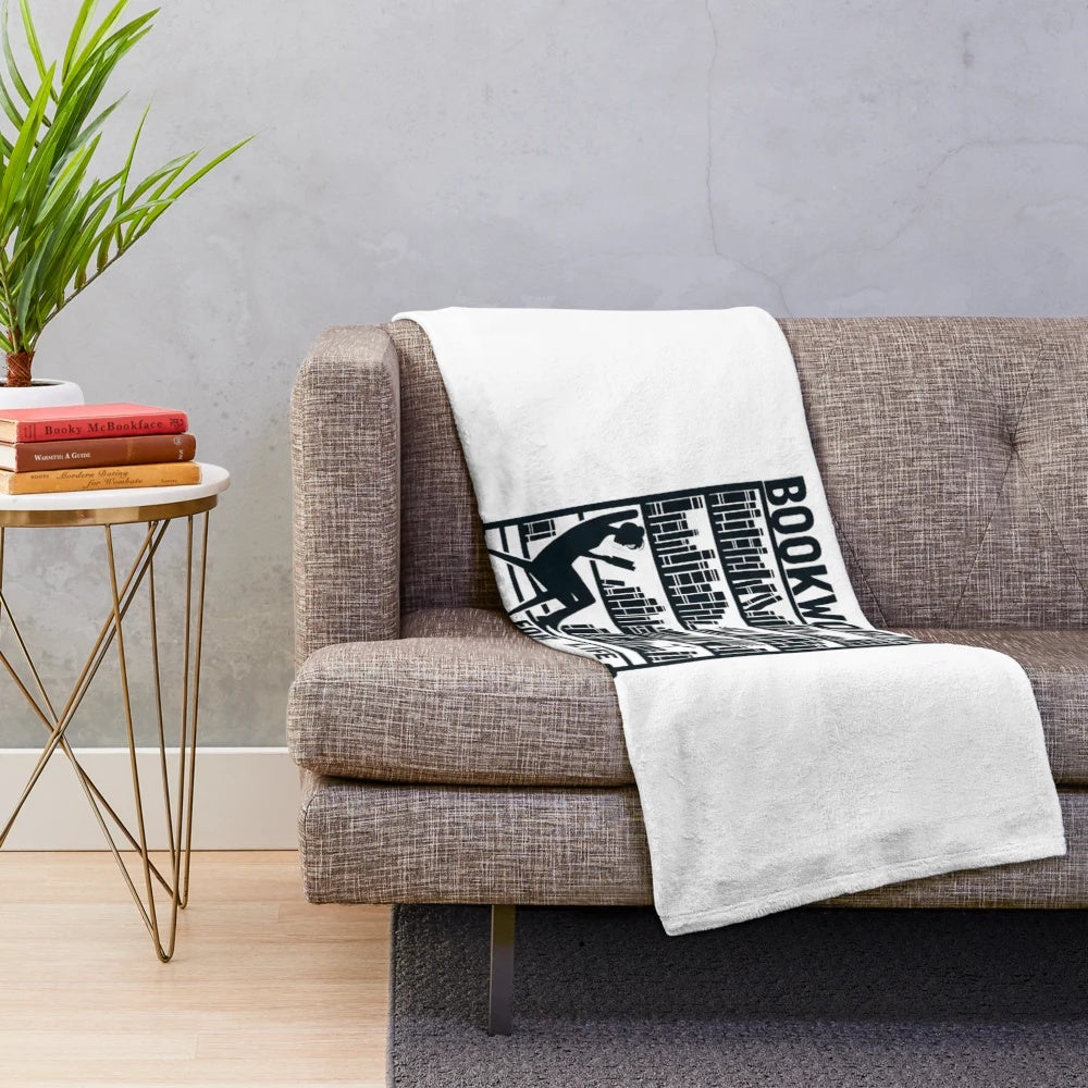 Cozy plush blanket featuring a bookworm design, perfect for book lovers