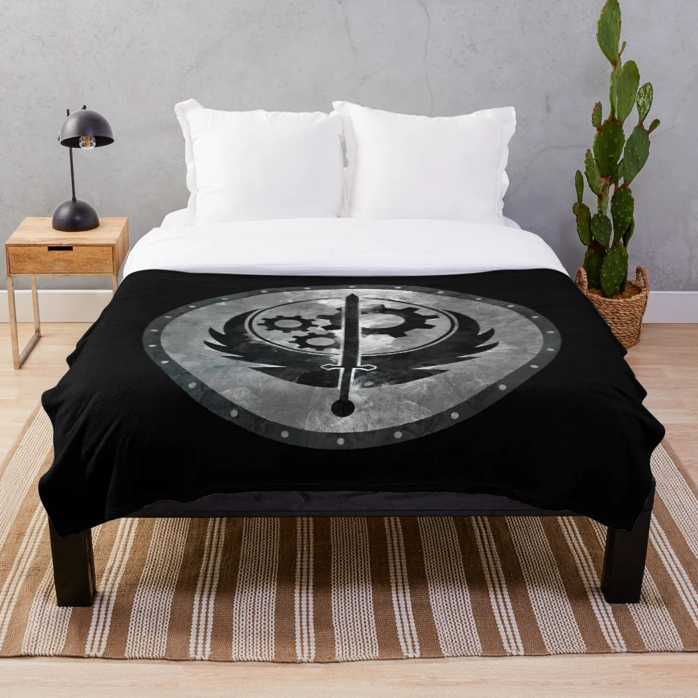 Plush blanket featuring the Brotherhood of Steel insignia from the Fallout video game series
