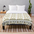 Soft, plush blanket featuring a painting of cute Hampshire Down lambs on a farm