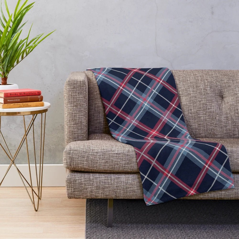 Plush blanket with traditional Scottish tartan pattern in navy blue